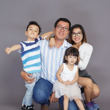 This Asian family looks happy after talking with their counselor.