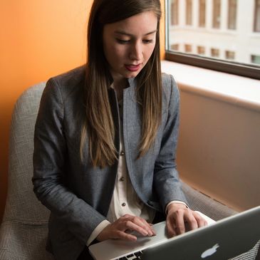 This woman uses a computer to reach her therapist.  Family Matters provides online counseling