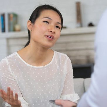 This Asian woman talks honestly with her counselor about her feelings to find happiness and peace.