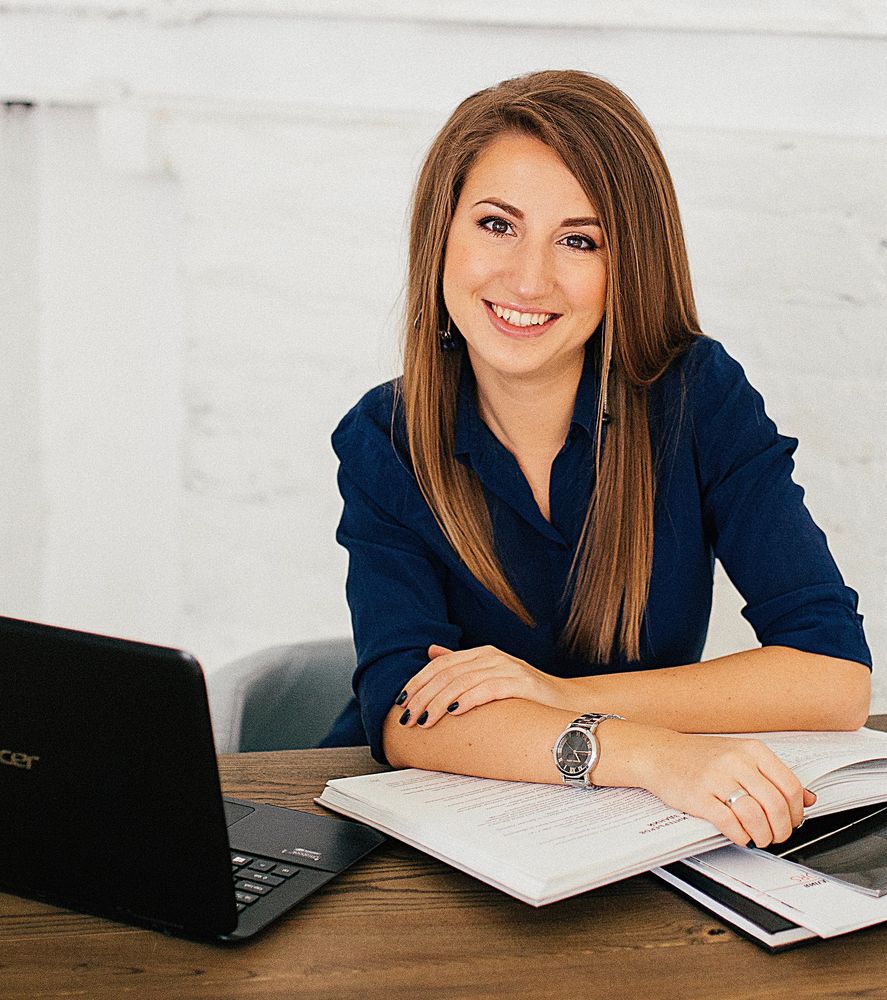 Therapist using a computer and phone to provide therapy and counseling online for adults and couples