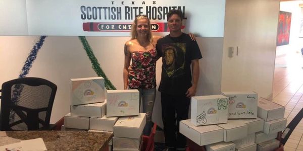 Volunteers delivering smile boxes to Scottish Rite hospital in Dallas Texas