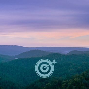 Our strategic pillars. Serene view of a mountain with symbolic target.