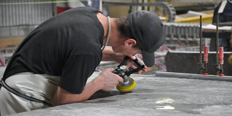Worker polishing a countertop