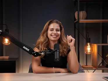 Podcaster enjoying a recording session in a Dubai podcast studio.