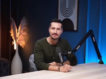 Podcaster preparing for a recording in a Dubai podcast studio.