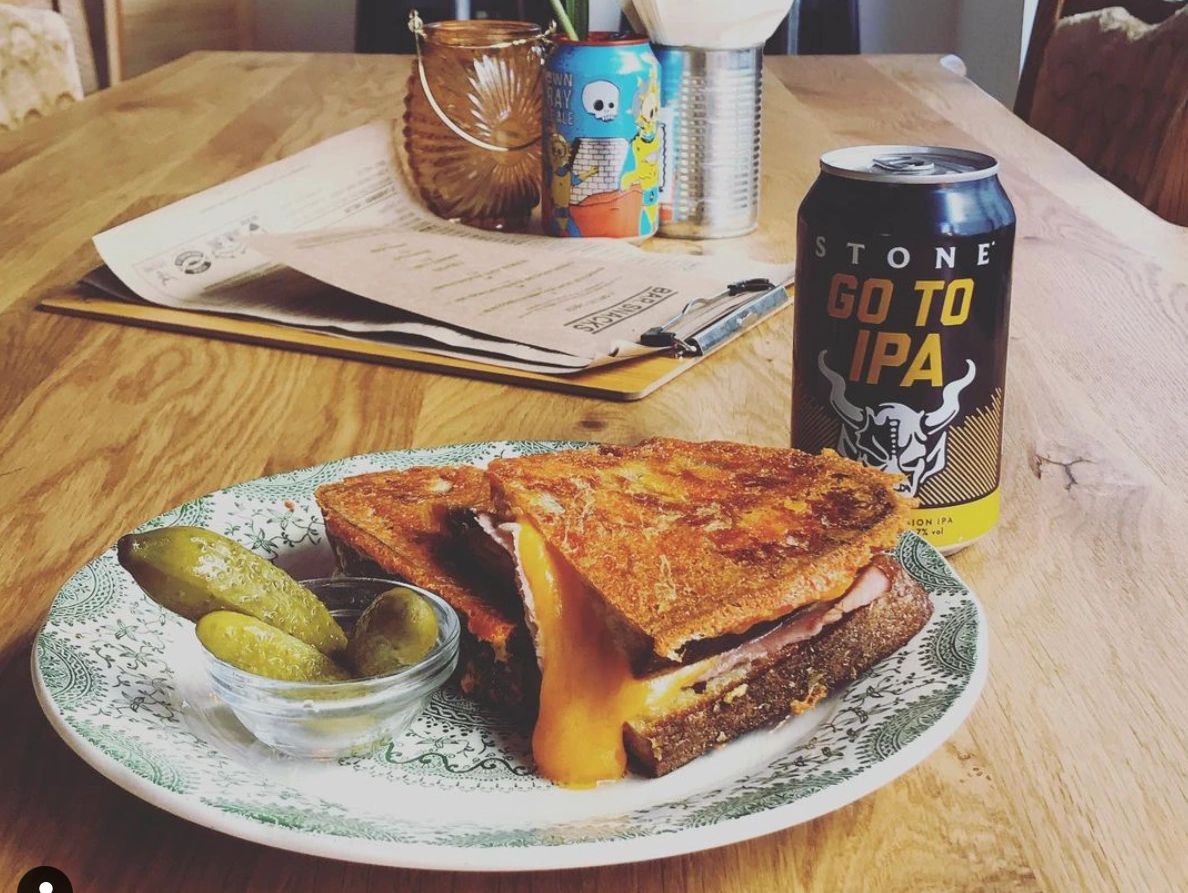 Grilled Cheese sandwich on a plate with a can off Craft beer