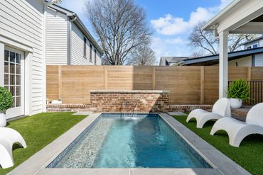 Chic backyard with sleek pool and loungers