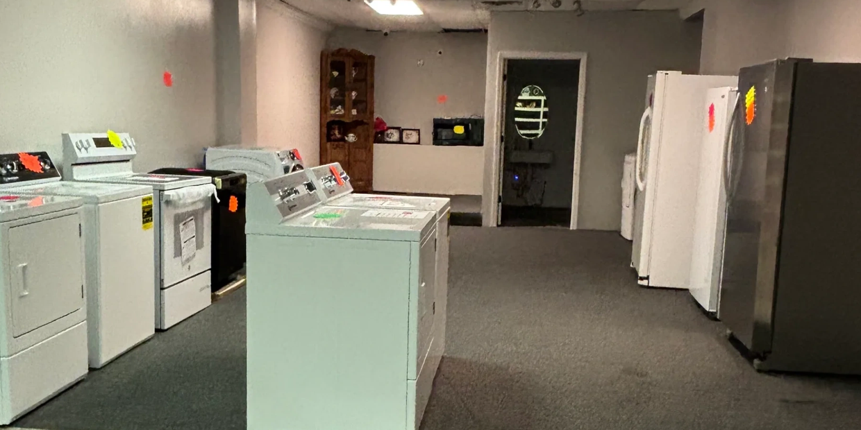 Showroom with various household appliances lined up.
