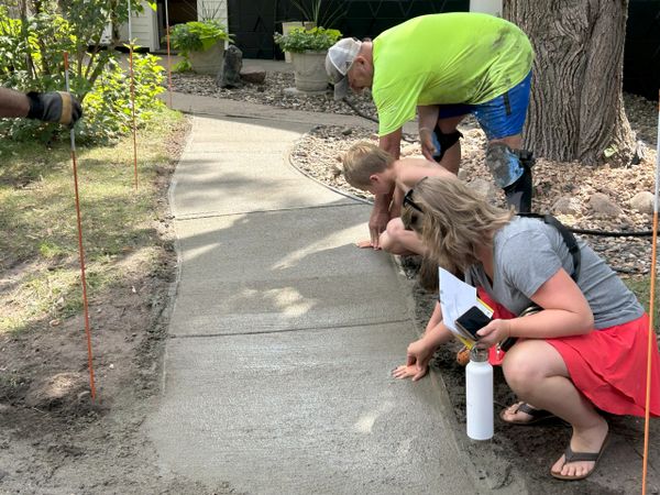 pouring cement sidewalk