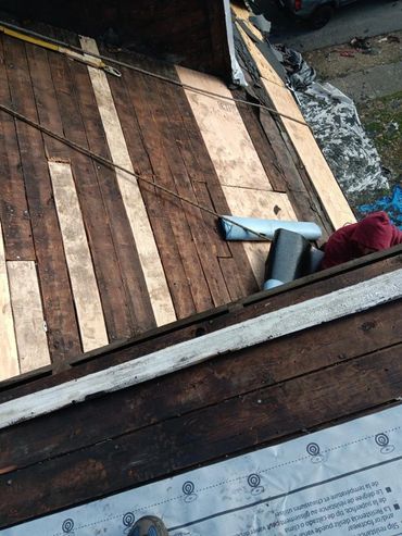Repaired wood pitched roof.