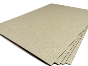 Stack of plain brown cardboard sheets.