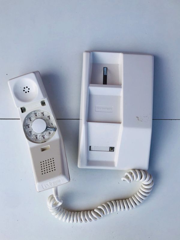 a 1966 white rotary dial phone