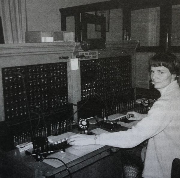 Coral Storey sits at the switchboard in Miami's telephone office. Photo taken in 1971.