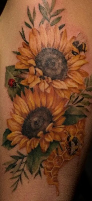 Gorgeous colour realism sunflower tattoo