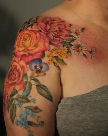 Gorgeous, painterly, colour realism floral half sleeve and shoulder cap