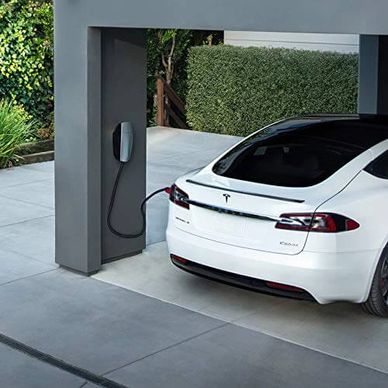 Tesla Wall Connector charging a Tesla vehicle