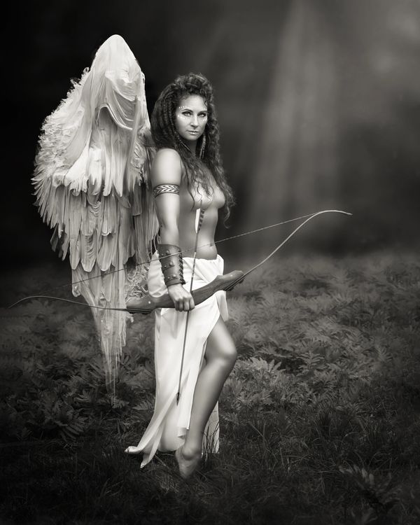 Stunning black and white woman with wings, cupid, fantasy