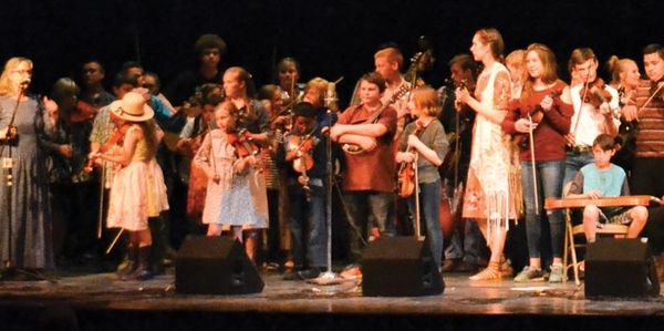 More than 100 Music Roots students gathered on stage for the grand finale at the Ozark Folk Center