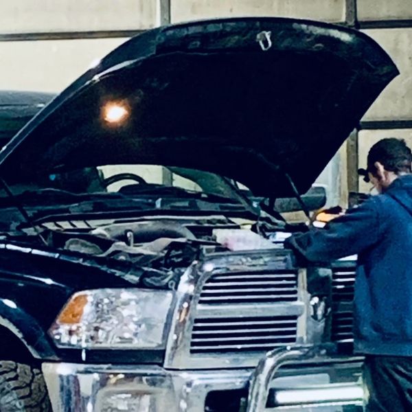 Technician performing repairs on a Dodge Ram 3500
