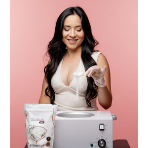 Applying sugar wax on forearm for hair removal treatment.