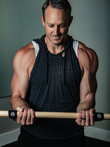 Instructor exercising with the stick