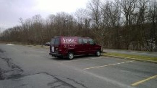 Veritas Heating and Cooling van in a parking lot