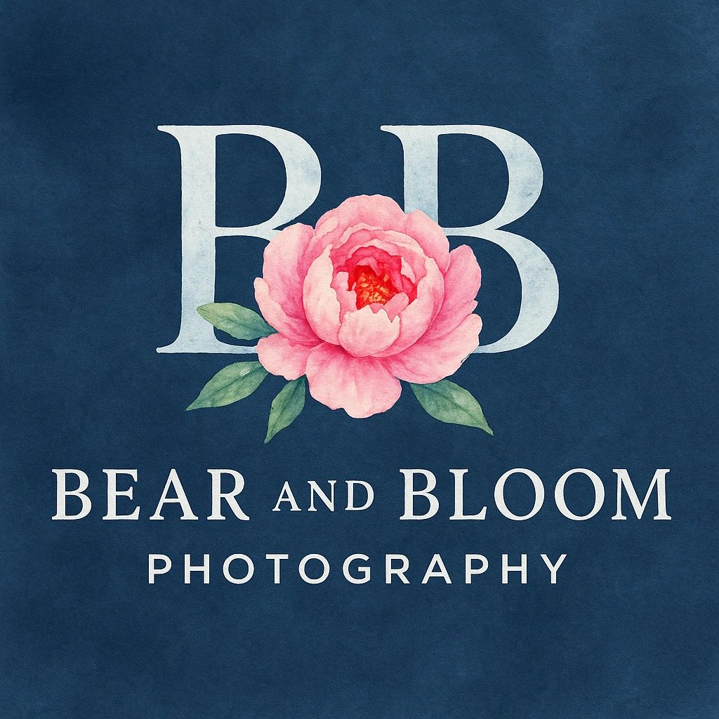 Logo for Bear and Bloom Photography featuring a pink flower on a dark blue background.
