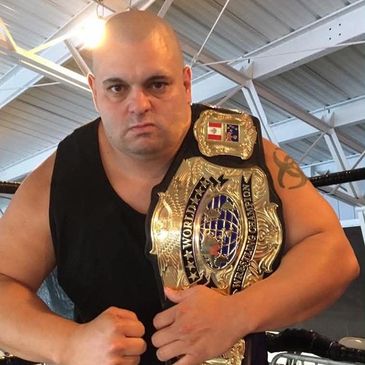 Dan Bidondi current AIWF New England Champion and AIWF New England Tag team Champion with Russian Ma