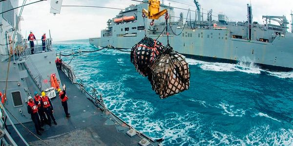 Boatswain's Mates performing Underway Replenishment (UNREP) on a U.S. Navy Ship.