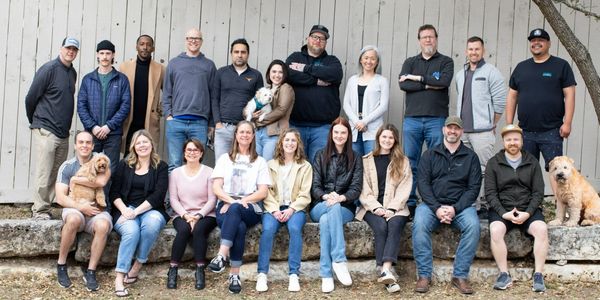 Group photo of BirdRock Home Employees and their dogs