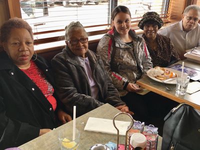 photo of people posing in a restaurant