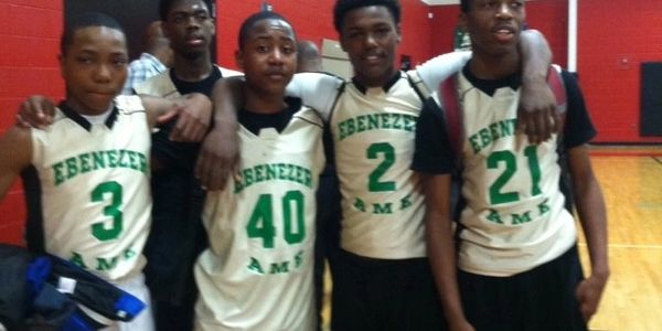 group of people wearing green and white shirts
