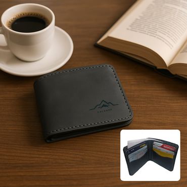 Black leather wallet on a wooden table with coffee and an open book.