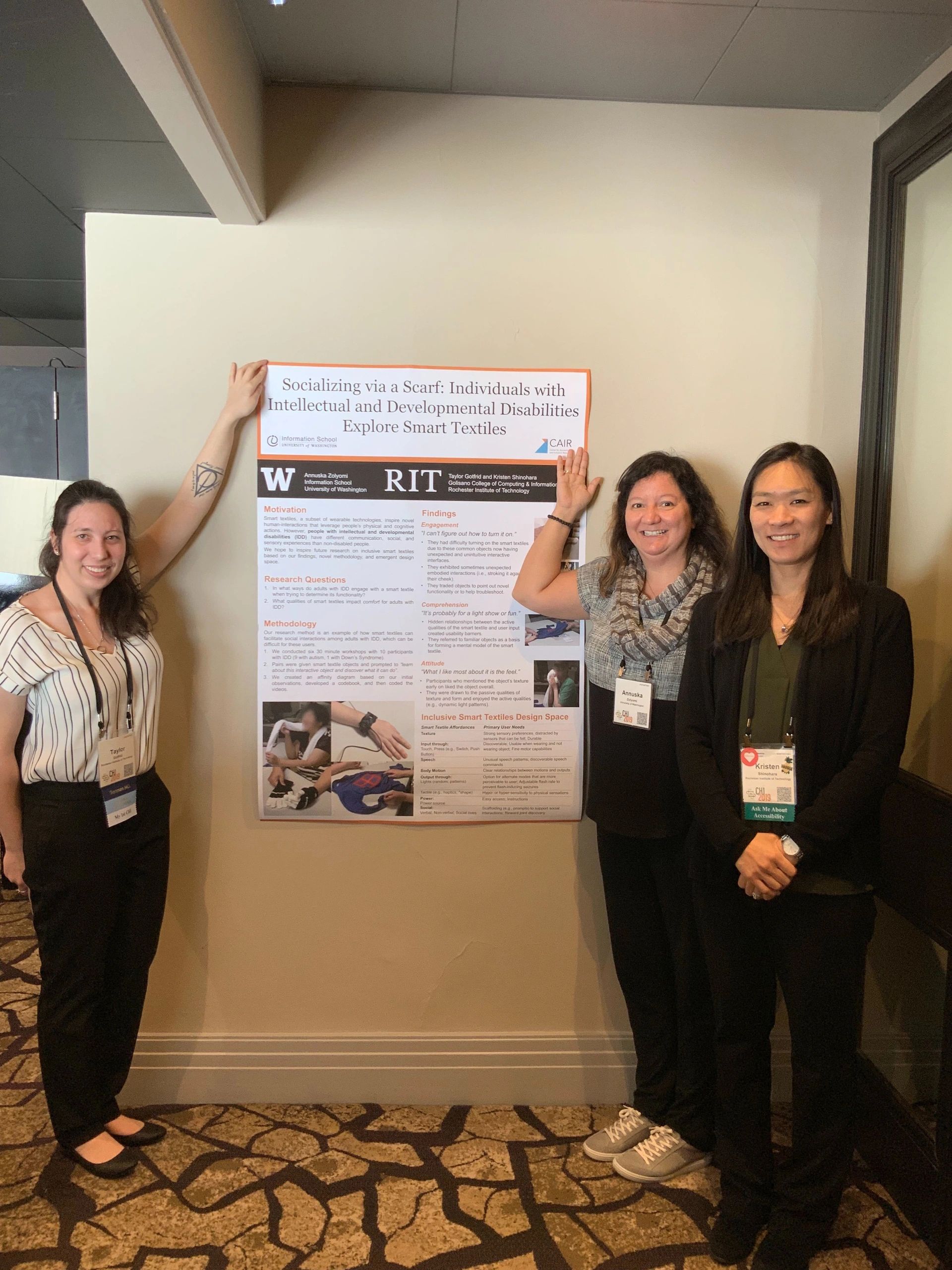 Annuska showing CHI 2019 poster, along with co-authors.