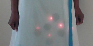 Skirt with lace and ribbon trimmings, with LED lights shining through.