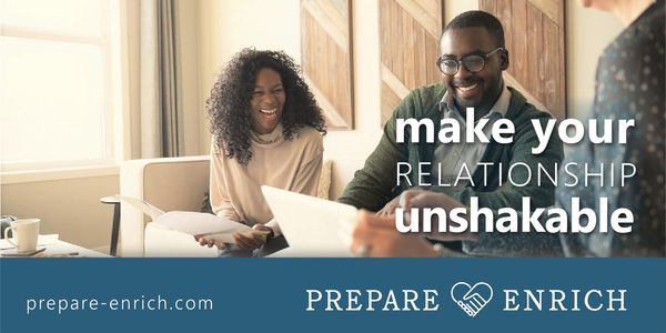 Couple smiling and working together with text promoting strong relationships.