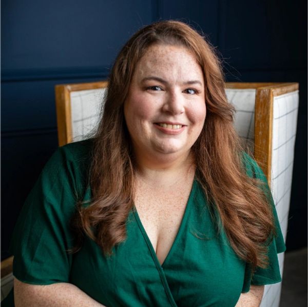Insurance agent smiling, offering Medicare and insurance guidance
