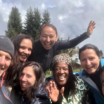 A happy group of people taking a selfie on a Zen retreat