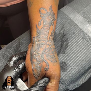 Indigo Tattoos shop best shop in Memphis.Hand cover up tattoo -tatts by Eric delshun