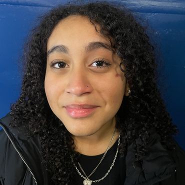 girl smiling loving her nose piercing at indigo tattoos