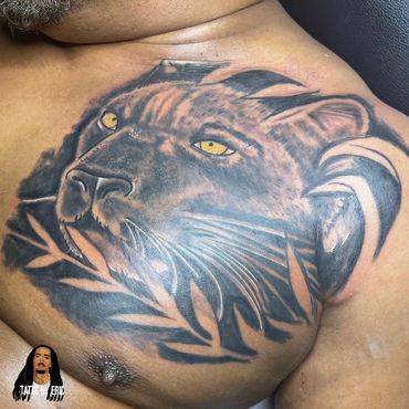 Panther chest cover up tattoo done by Eric Delshun at Indigo Tattoos Shop in Memphis Tn