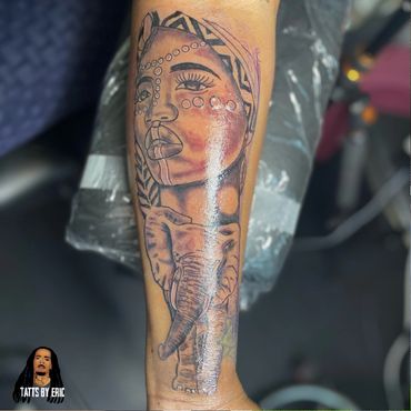 Elephant and African lady arm tattoo done by Eric Delshun at Indigo Tattoos Shop in Memphis Tn
