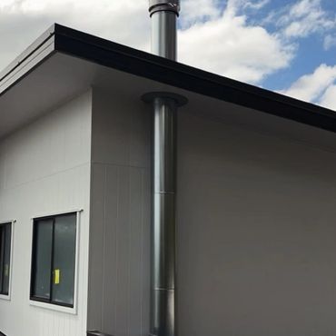 Clean stainless steel flue install on the Sunshine coast.