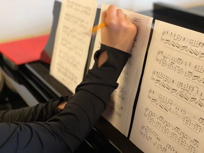Piano Student Marking Music