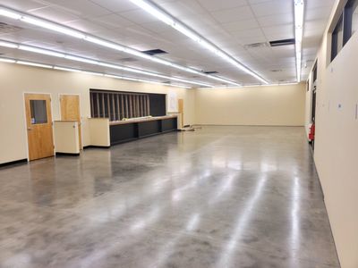 Commercial polished concrete flooring finished to a semi-gloss sheen.