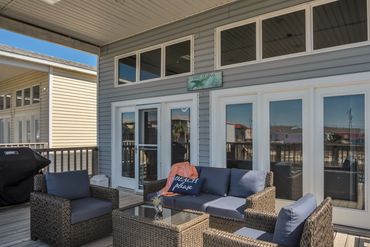 Large back deck overlooking fish pond