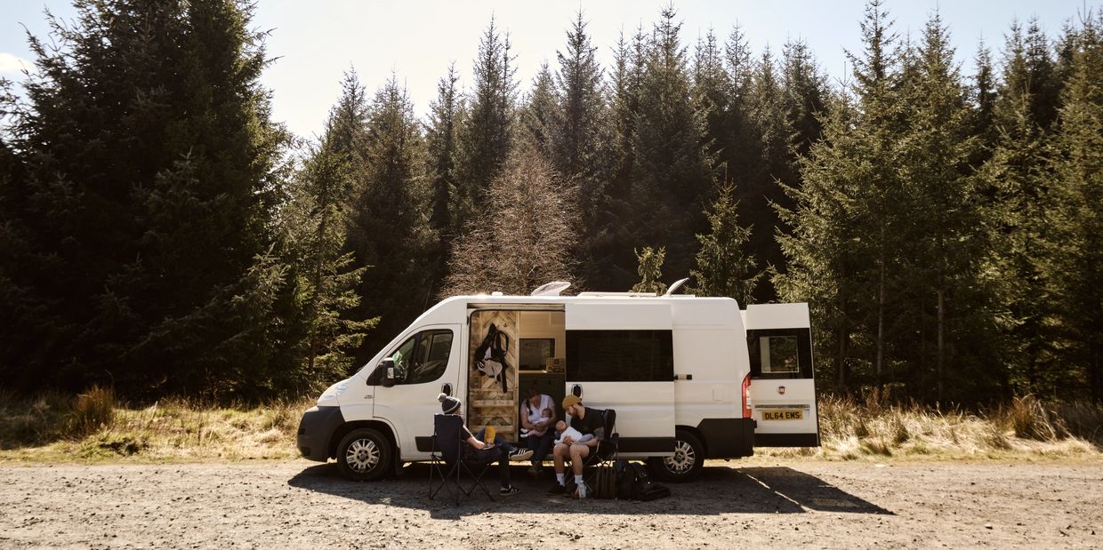 The northern conversions team camping with a picnic in a forest