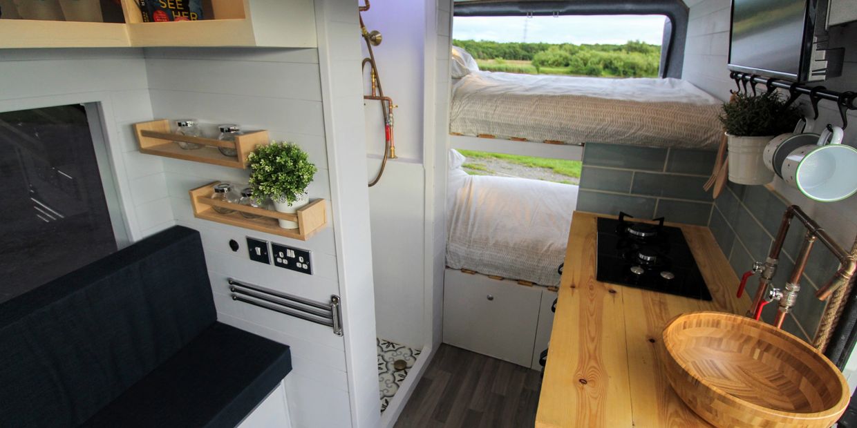 Quirky campers rental camper van with copper tap and shower head, along with shower