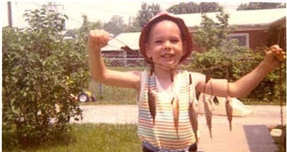 Me as a kid holding fish