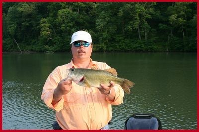 Dubby Carr, Owner of Dubby's Fishing and Hunting, shows off a great catch on Lake Anna, Virginia. 